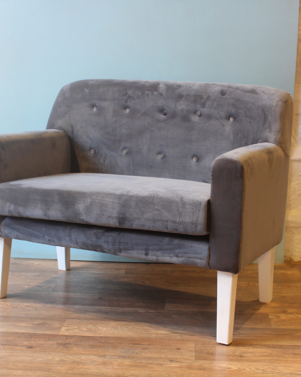 Modern grey velvet two-seater sofa for living room