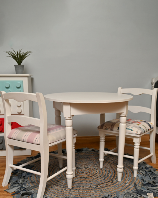 Handcrafted wooden study table set with white cushioned chairs