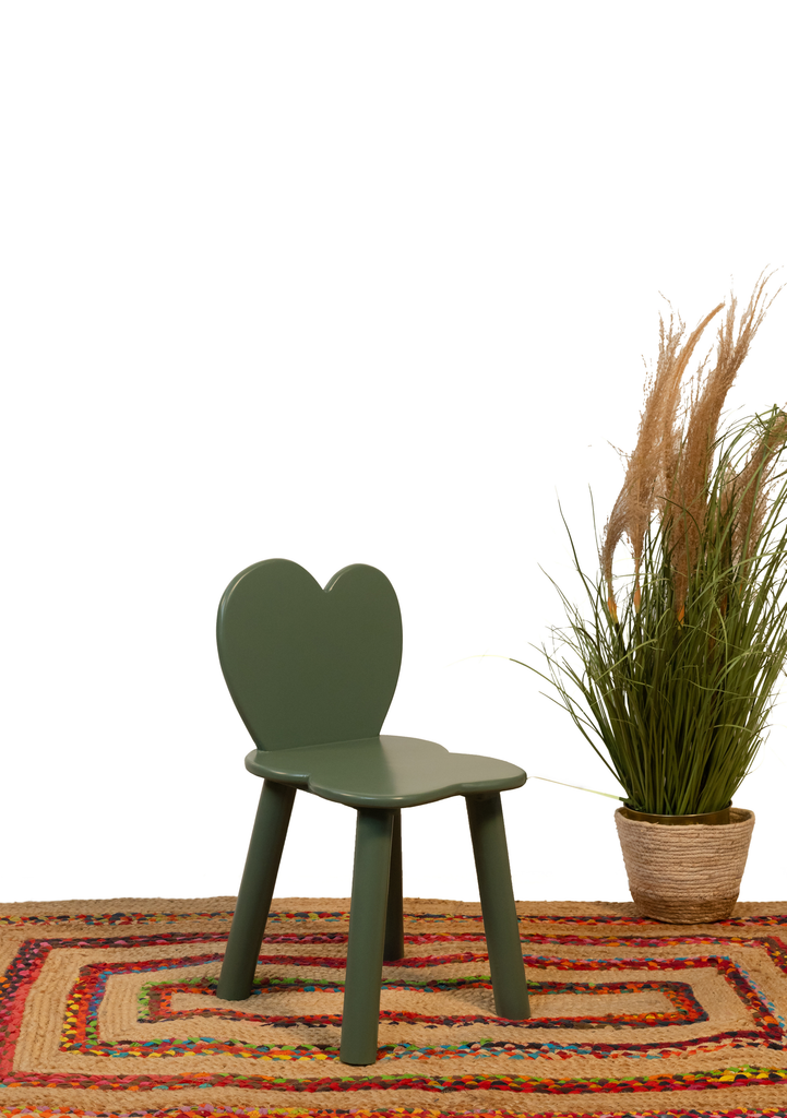 Round olive green tabletop with a flower-carved wooden base