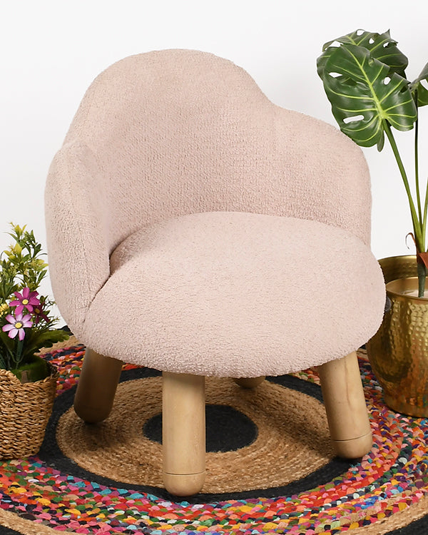 Small wooden lounge chair with soft upholstery