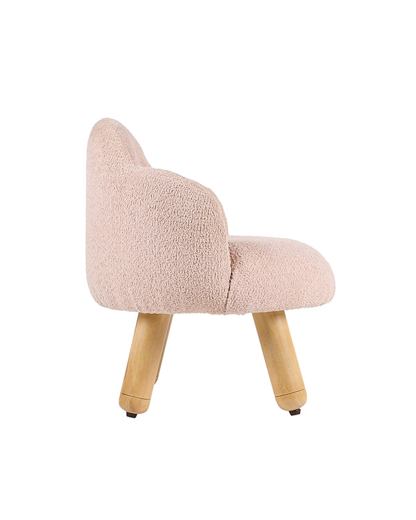 Kids chair with rounded back and pastel pink fabric