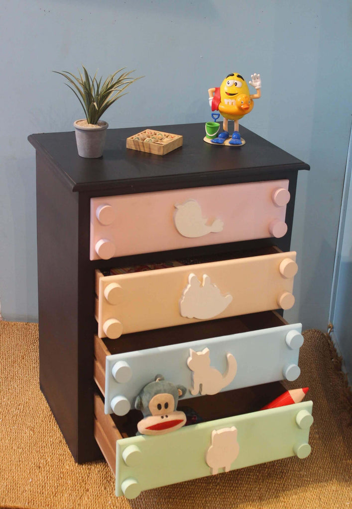 Cute and colorful wooden chest of drawers with animal cutout knobs